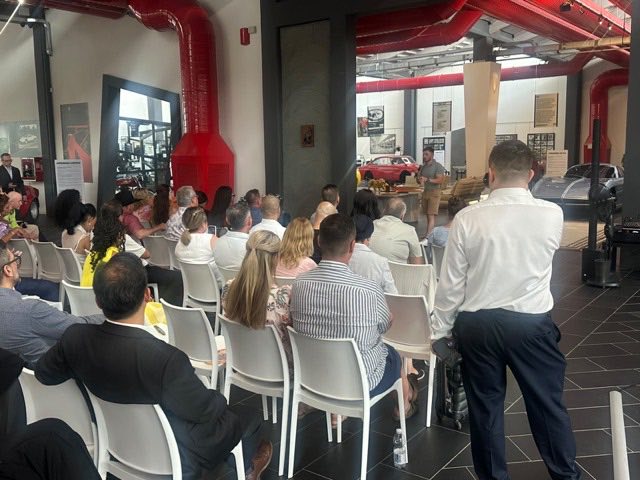 Lewis Hunter speaking to an audience at the Lamborghini Museum