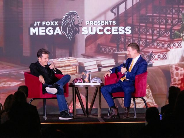 Vincent Hovorka interviewing Charlie Sheen on stage